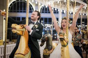 Wedding celebration with festive decorations and carousel lights creating a magical atmosphere. Lighthouse Point Park carosuel  New Haven CT