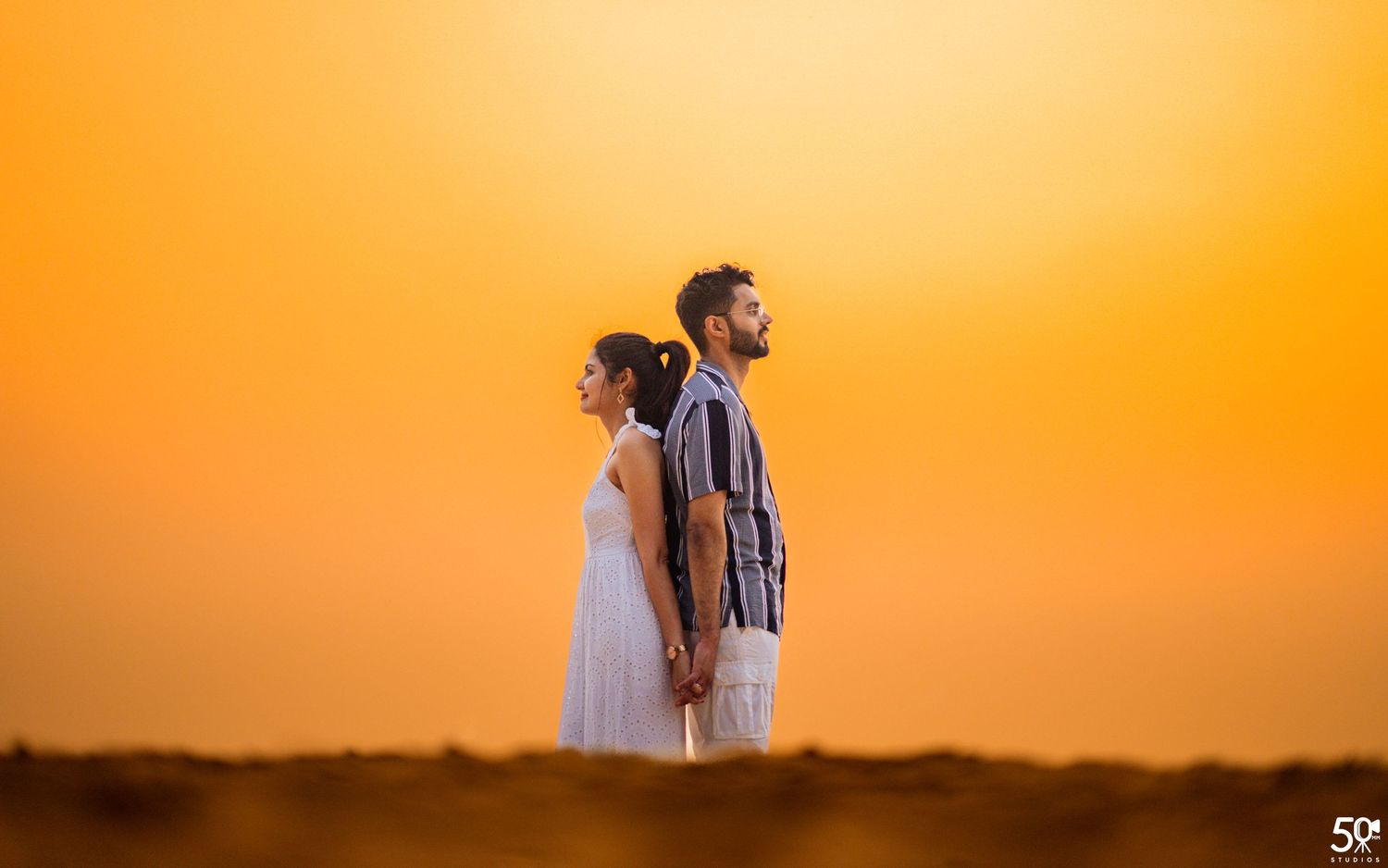 Best pre-wedding photography in Honnavara – editorial couple pose at golden hour by 50mm Studios.