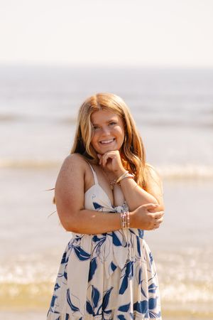 A series of candid beach portraits showing joyful expressions against a soft sunset background.