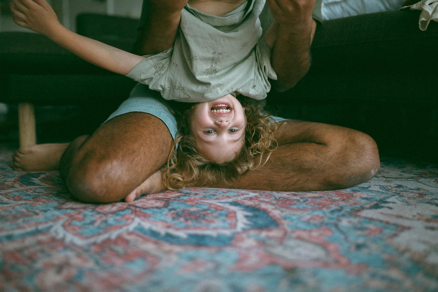 Melbourne boy kissing his newborn baby brother on the head
