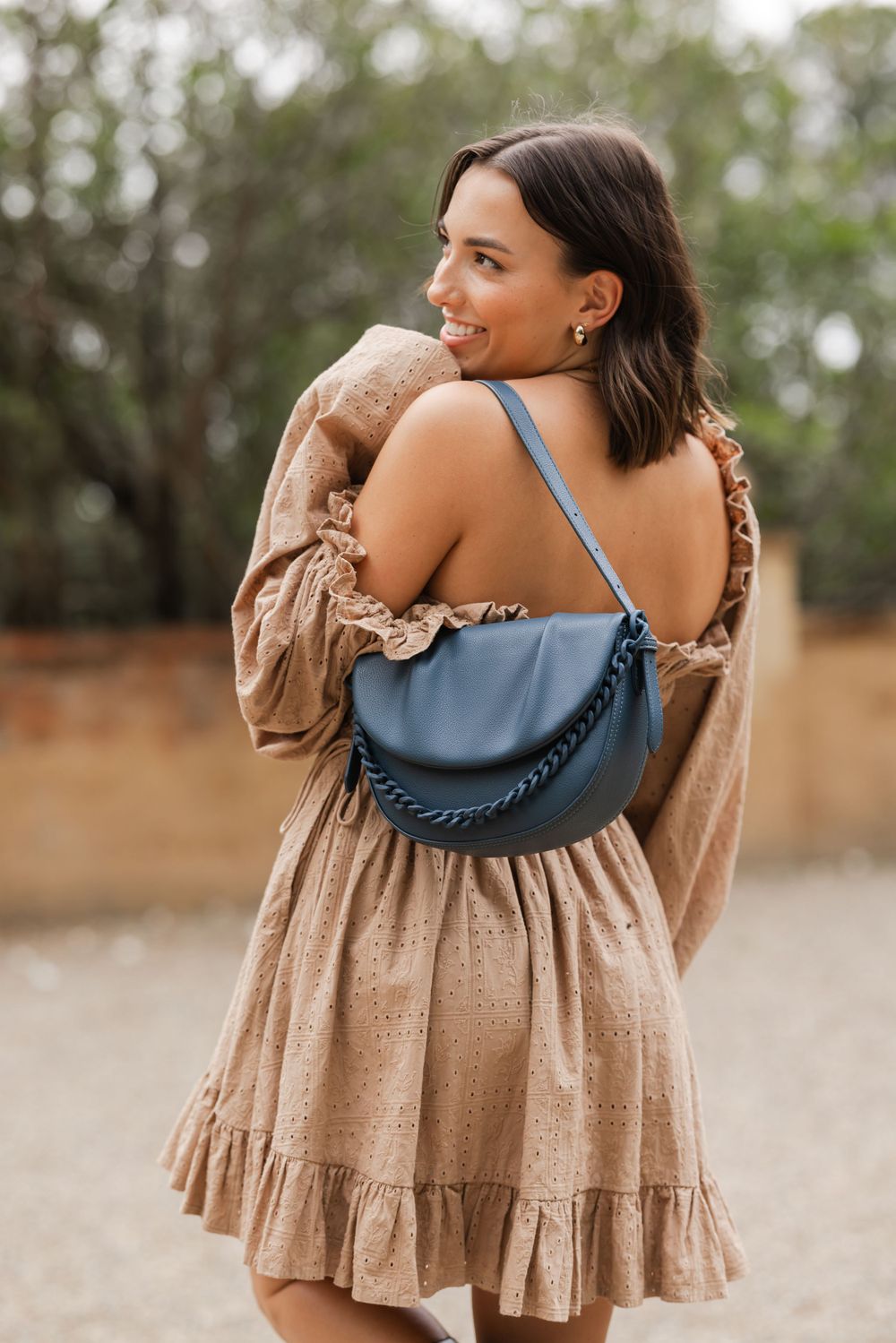 Girl posing with handbag