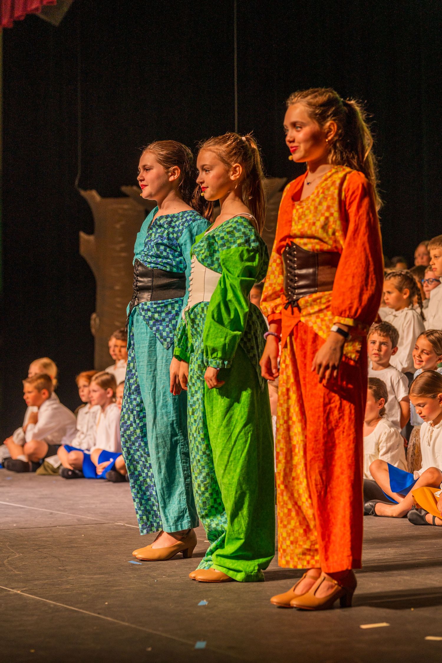Narrators during a play in costume