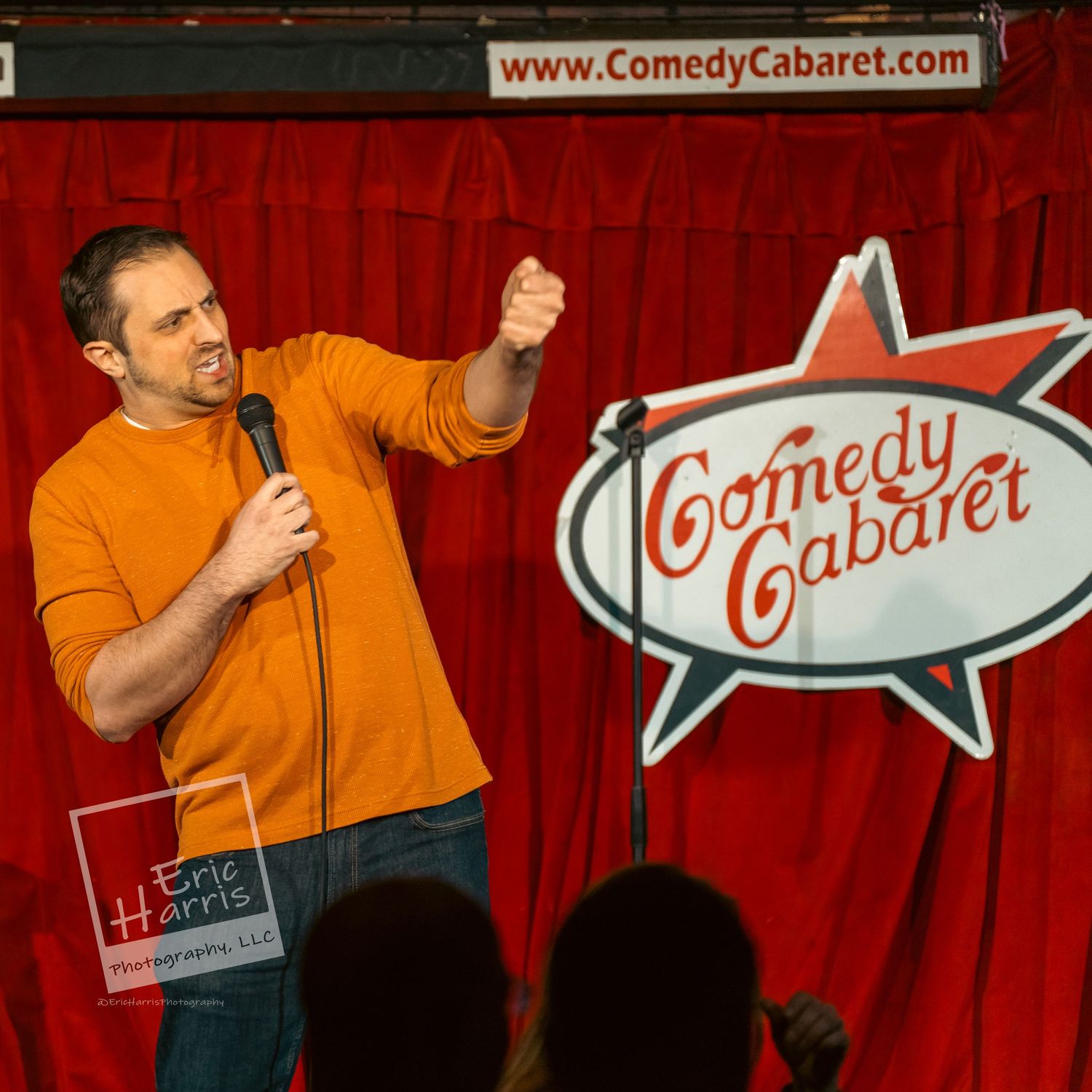 comedian on stage telling jokes