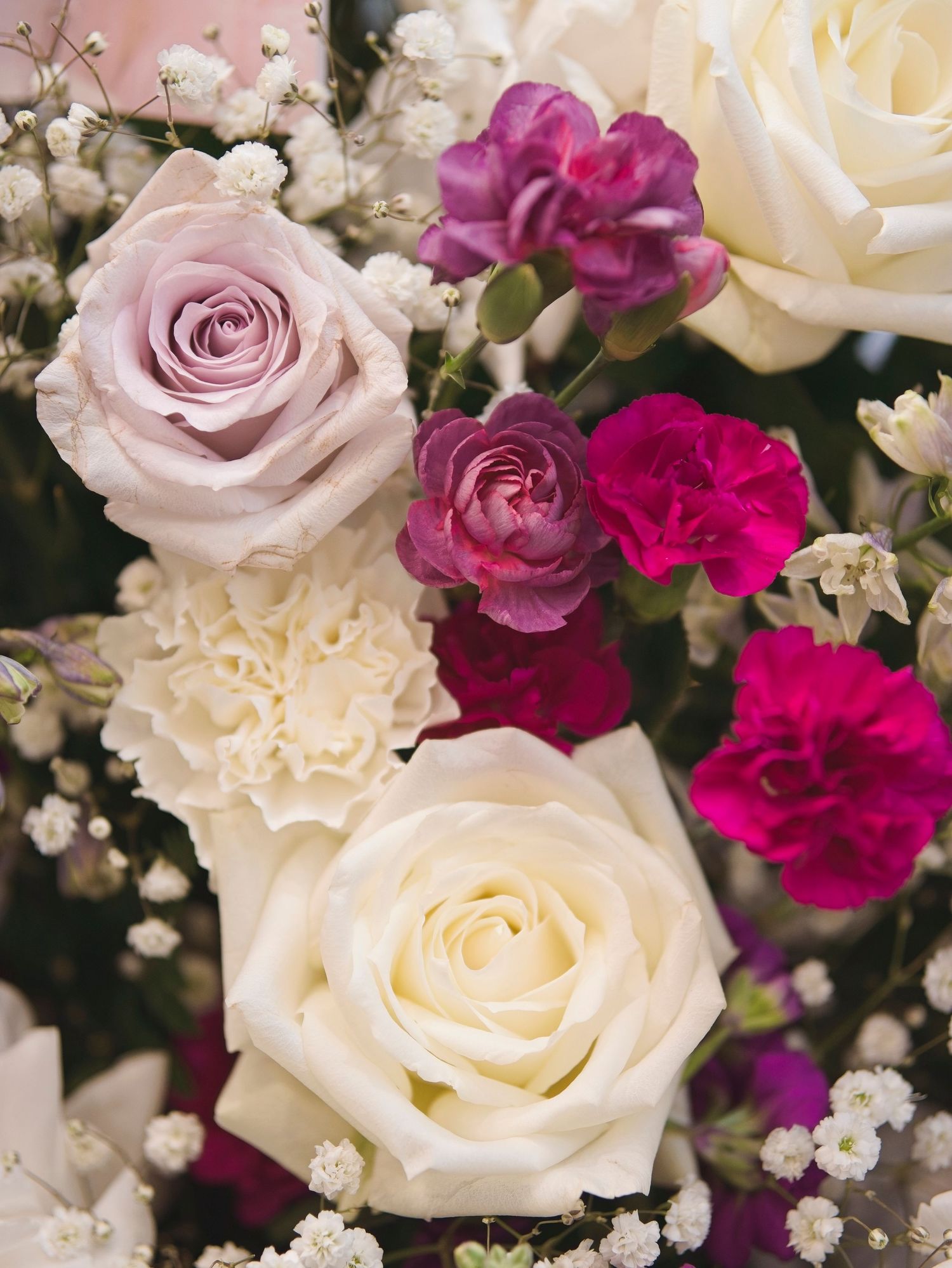 A gorgeous arrangement of white and pink roses and other flowers