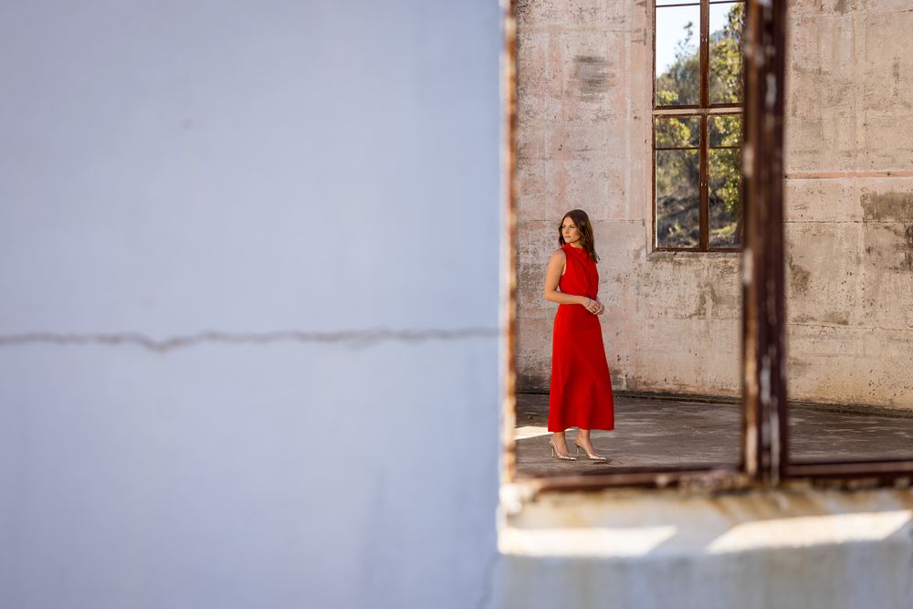 Kirstie Fitzpatrick, weather presenter and Journalist from 7 News Regional wearing a red dress at Mount Stromlo