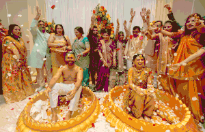 Joyous celebration during Indian wedding ceremony with colorful decorations and traditional attire.