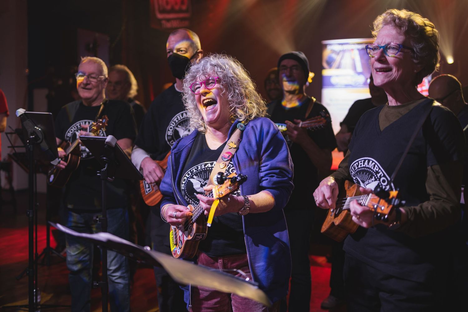 Band performing live on stage with colourful lighting and enthusiastic crowd, live music gig photography Southampton