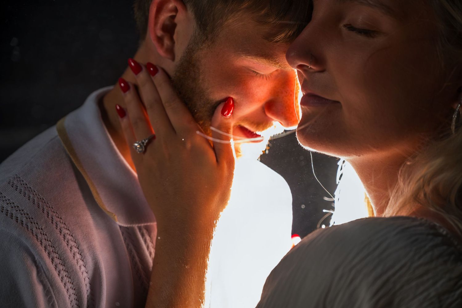 Close up side profile of couple in intimate romantic moment with warm glowing backlighting. myrtle beach photographer