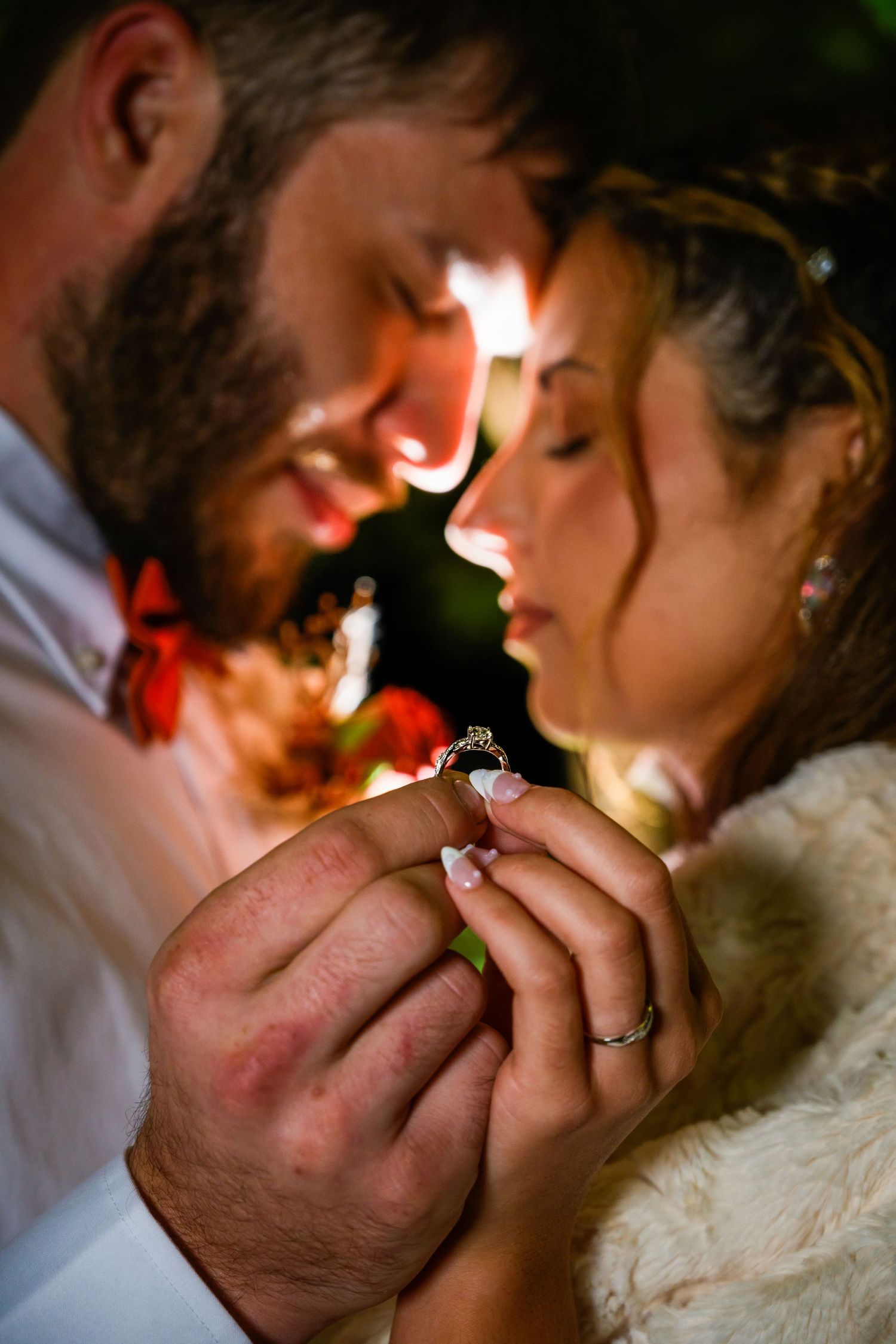 Close-up romantic moment displaying engagement ring in warm evening light. Myrtle beach photographer