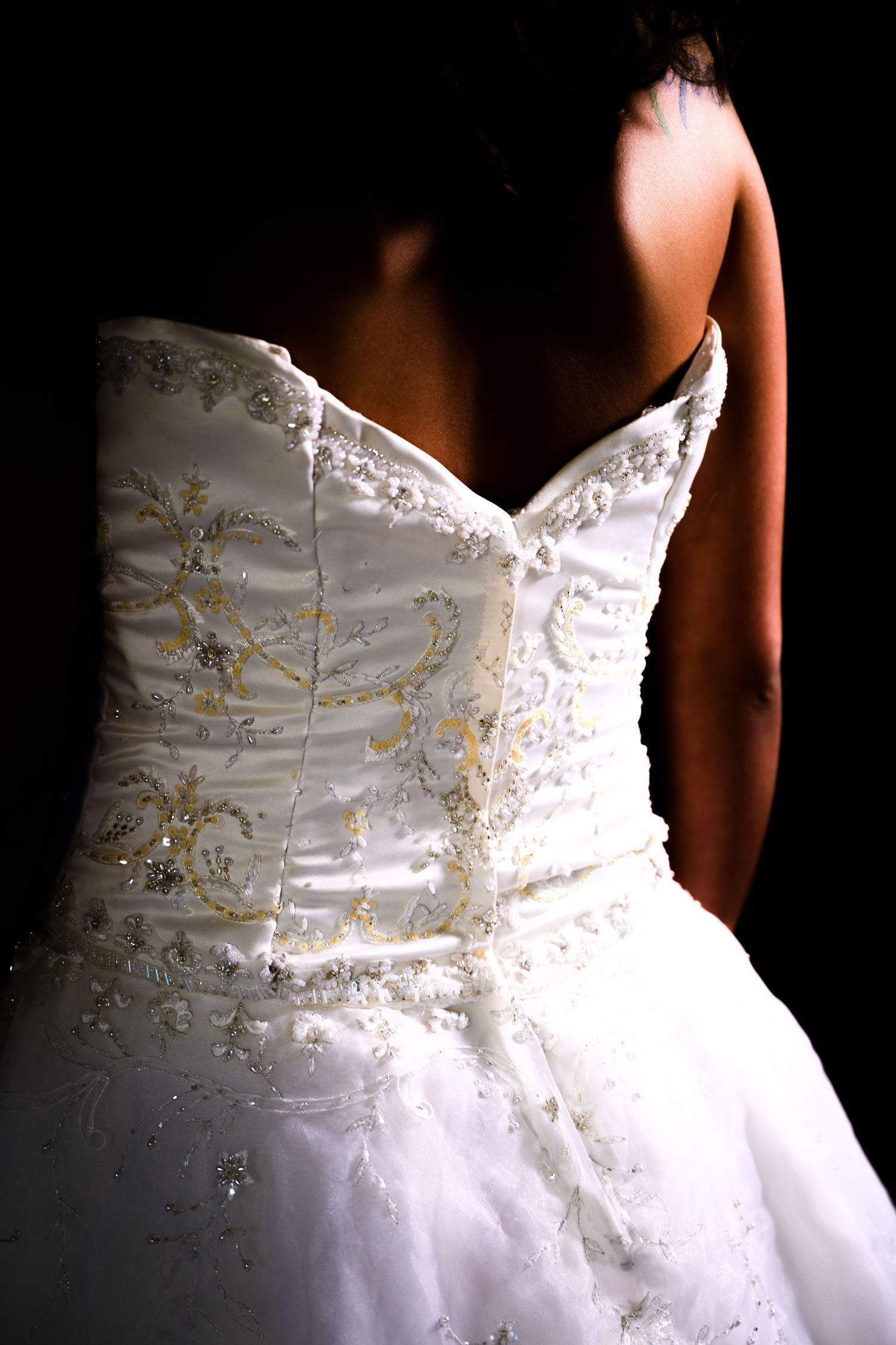 Close-up detail of white beaded wedding dress bodice with sweetheart neckline. Myrtle beach photographer