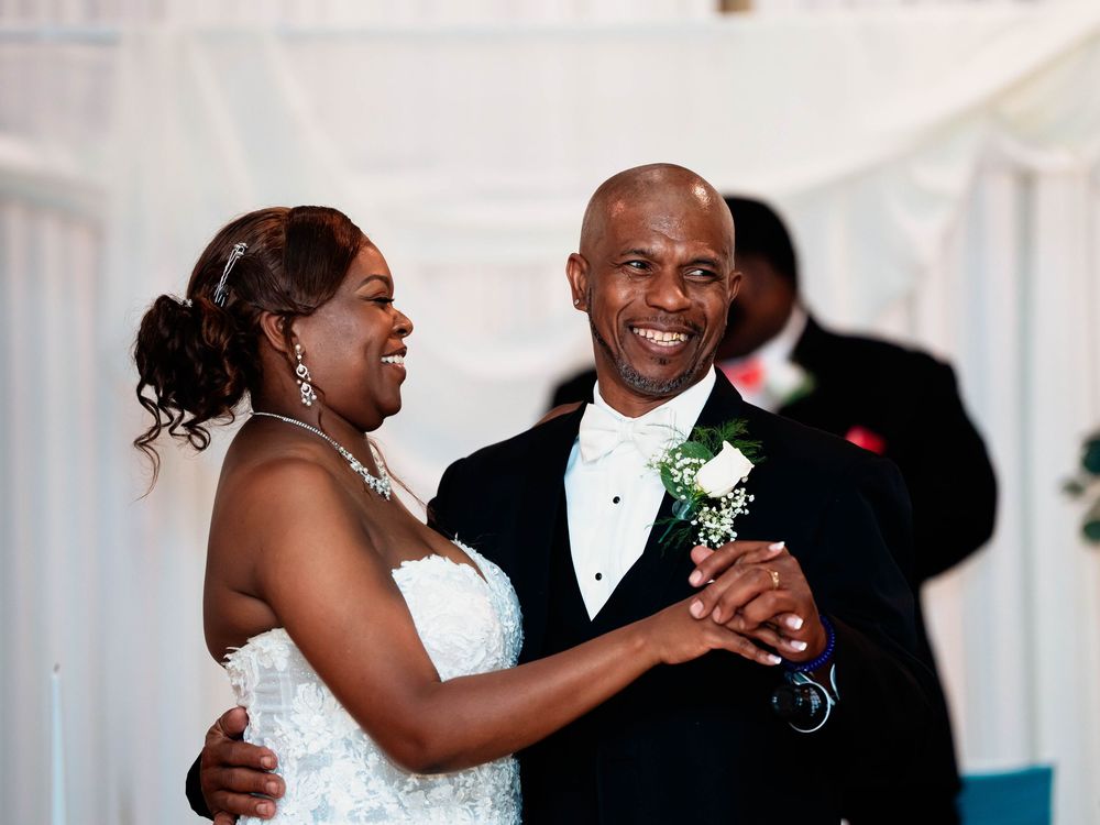 Candid wedding reception moments show joyful dancing between guests in formal attire and wedding party members.