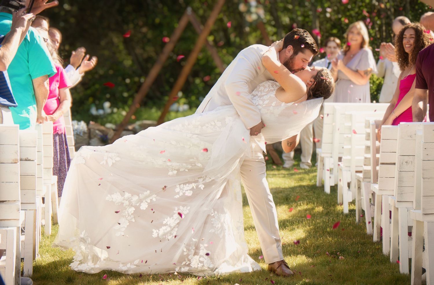 you may now kiss the bride walking down the aisle dip and kiss in spokane washington wedding ceremony.