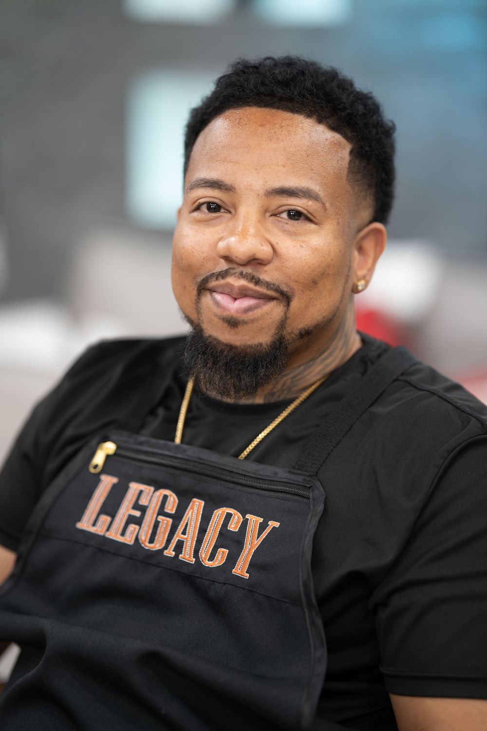 Close-up portraits showing person in black Legacy shirt with confident expressions.