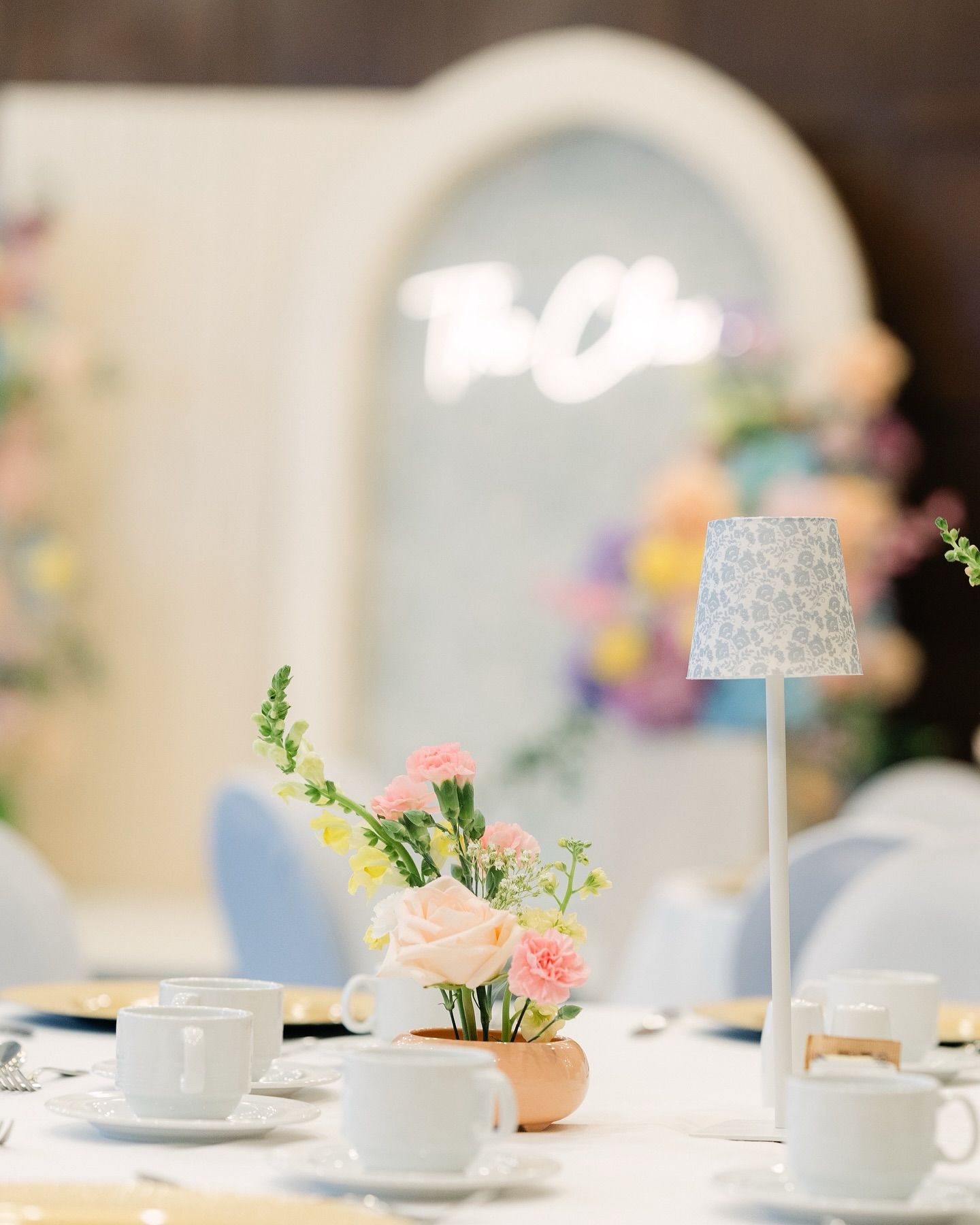 wedding table styling with pastel florals and soft ceremony backdrop in Regina events decor