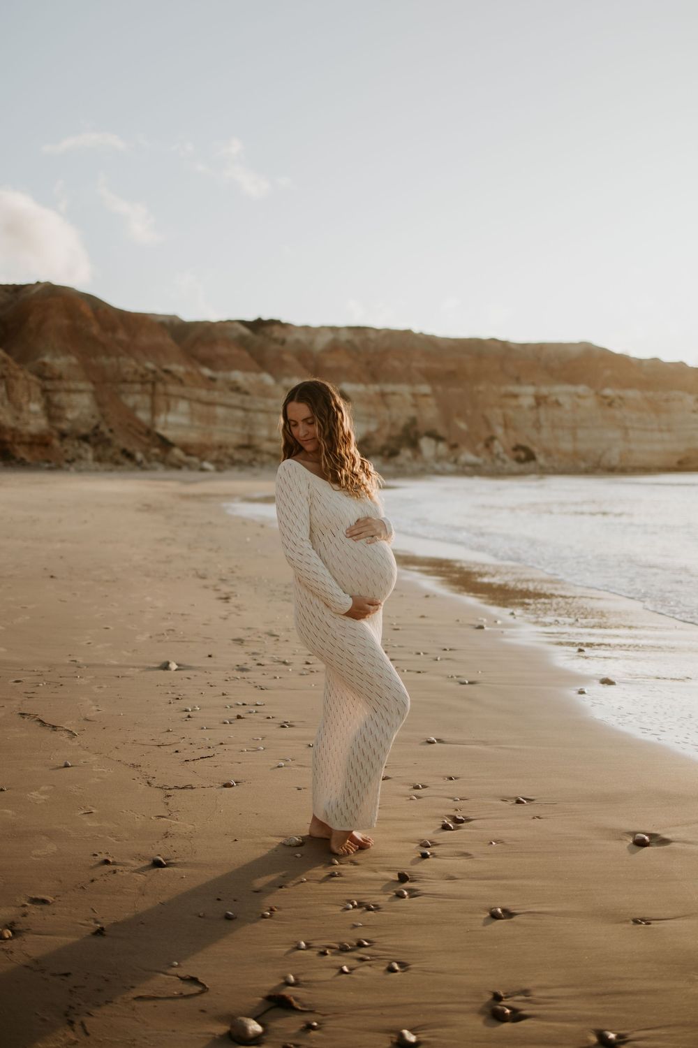 Pregnant mum during a natural sunset maternity photography session at Maslin Beach, South Australia