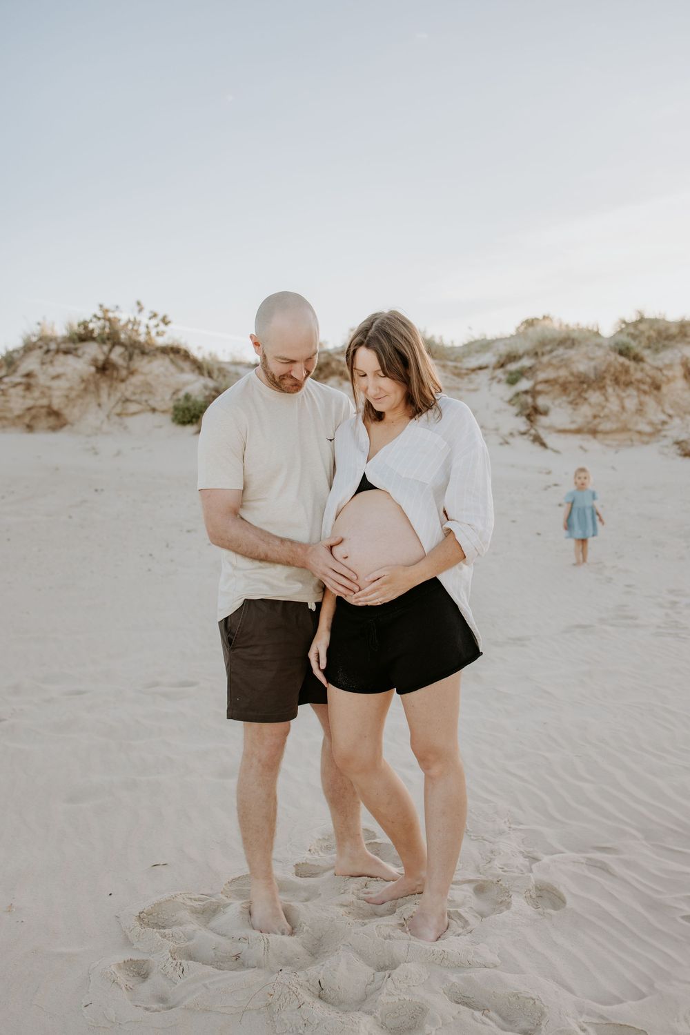 Natural beach maternity photography session with a young family at sunrise in Henley Beach South, Adelaide
