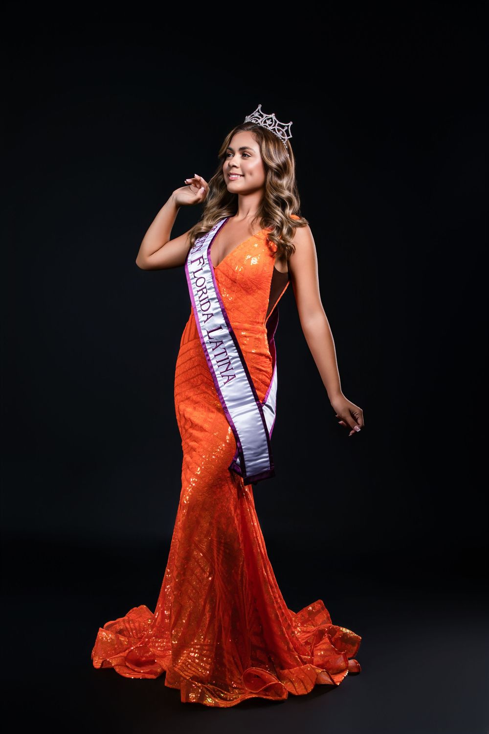 Pageant contestant strikes dynamic poses in flowing orange sequined dress.