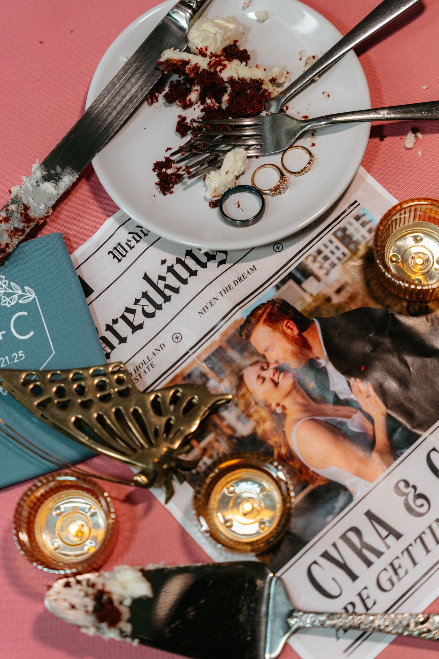 Overhead view of half-eaten chocolate dessert on plate with gold accents and vintage newspaper clippings in background.