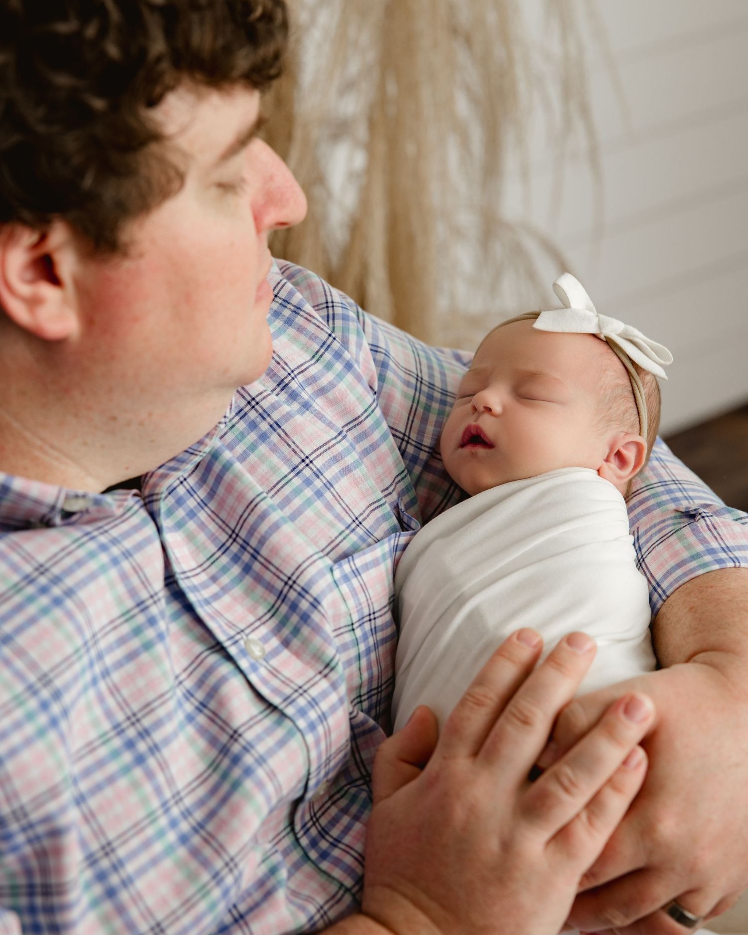 Dad and baby in a tender moment in a studio setting.  Middle TN Newborn photographer