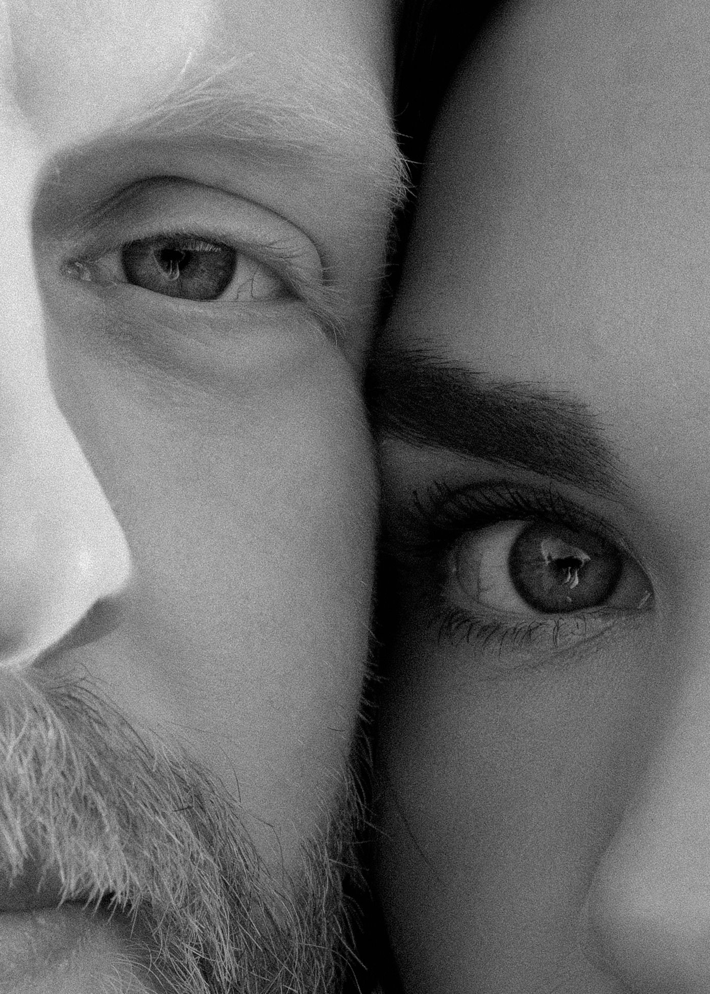 Black and white close-up portrait of a man and woman faces side by side, showing eyes and facial details.
