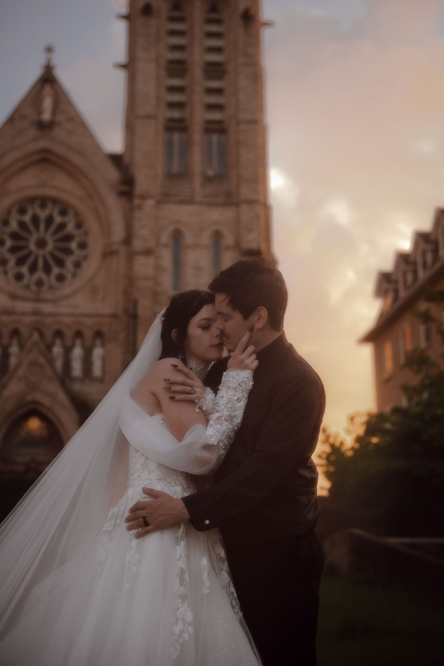 Bride and bride feeding cutting cake during wedding reception. LGBTQ+ wedding photographer.