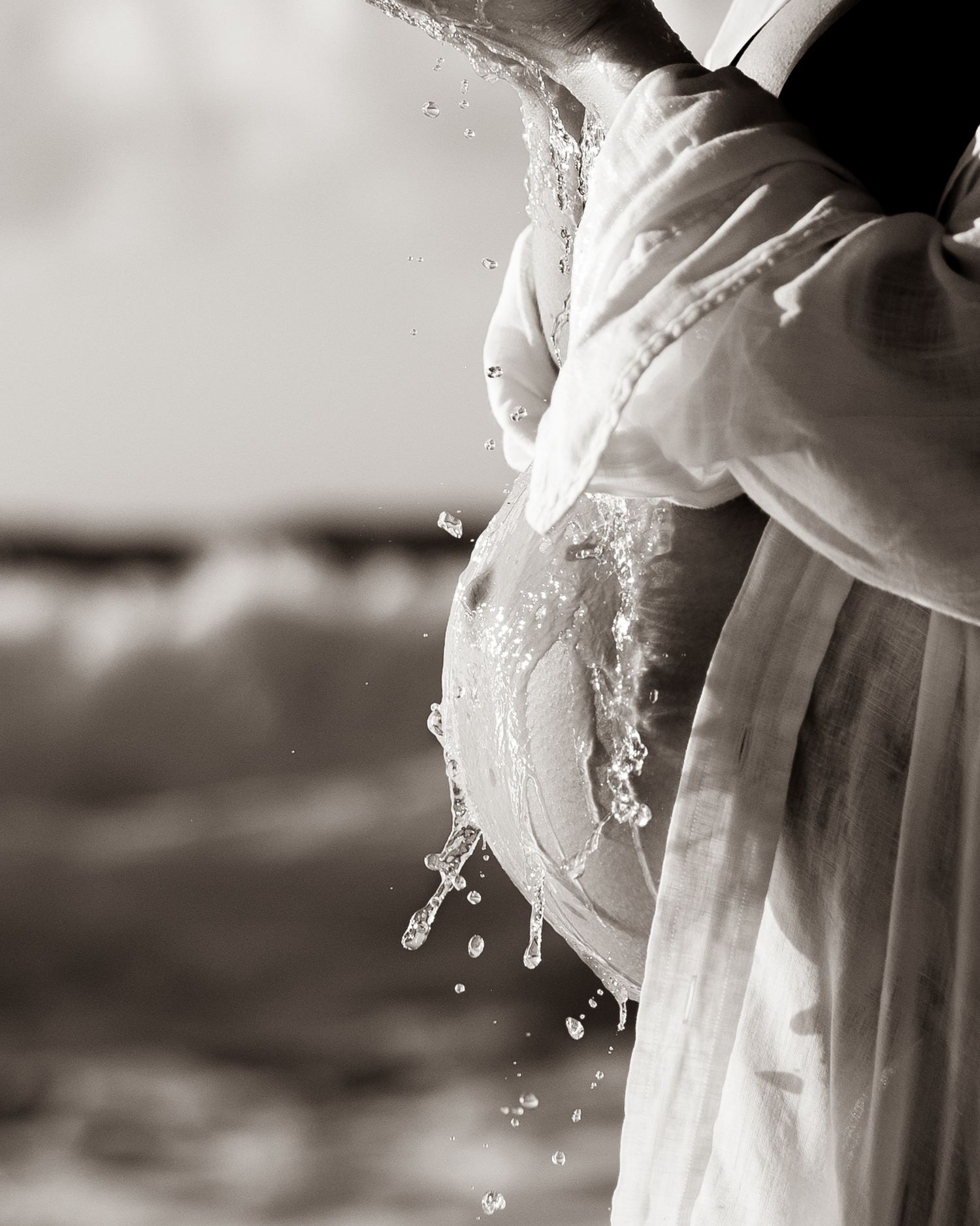 romantic maternity session with soft tones and dreamy backdrop