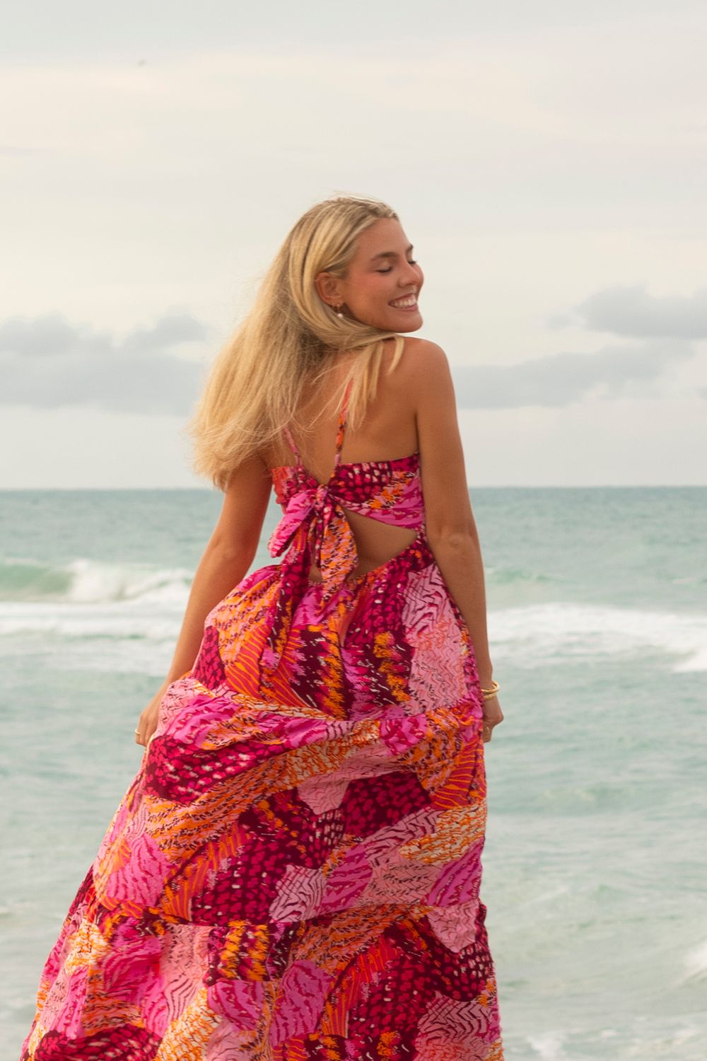 Girl smiling on the beach portrait session at the beach by Bella Vitale Photography, Stuart FL.