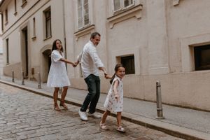 Moments of laughter and love during a family photo session in Upper Town, featuring scenic city views.