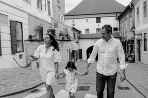 "Intimate family portrait in the historic Upper Town, showcasing their natural bond amidst the unique cityscape.