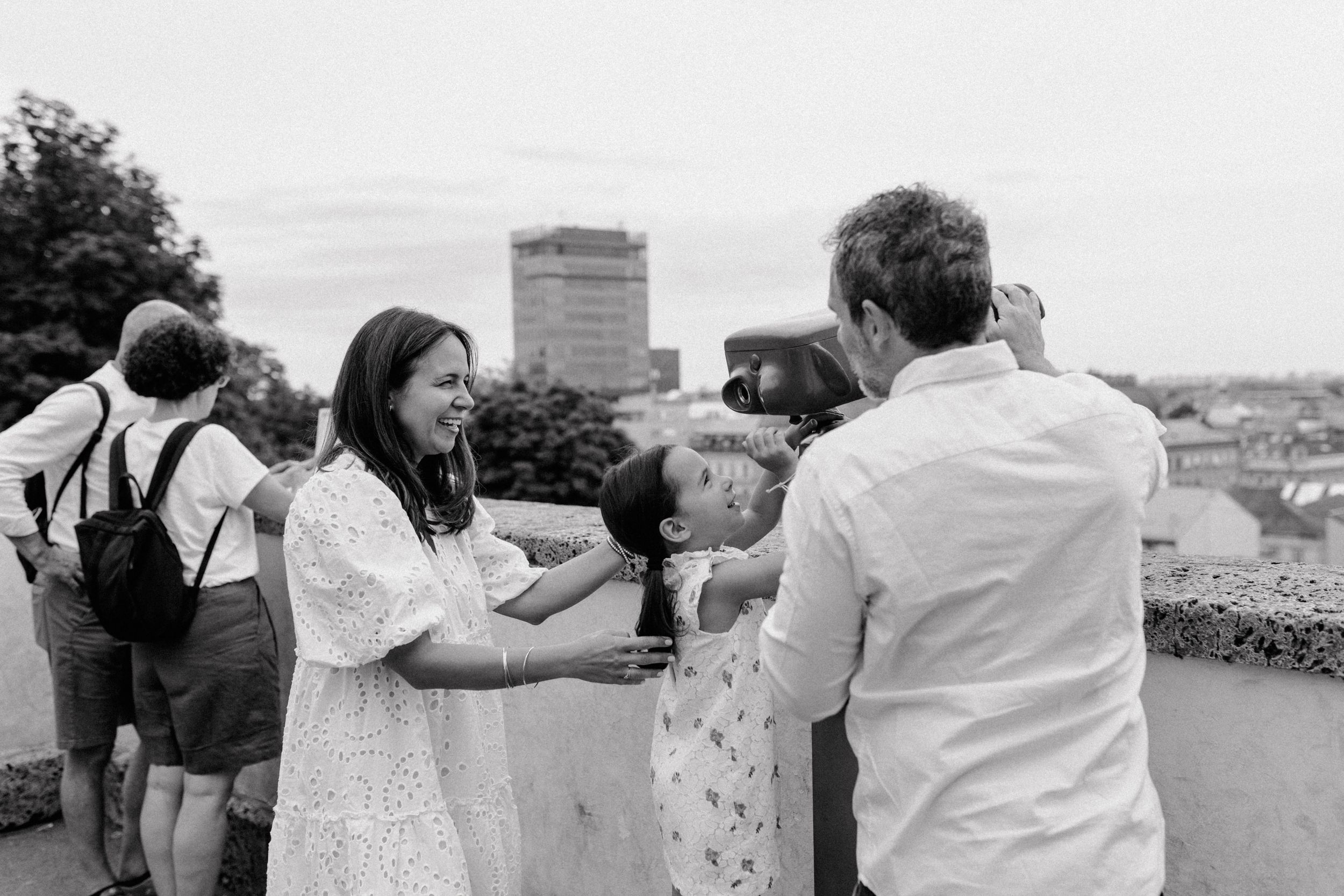 Family enjoying a sunny day in Upper Town, Zagreb, with candid moments.