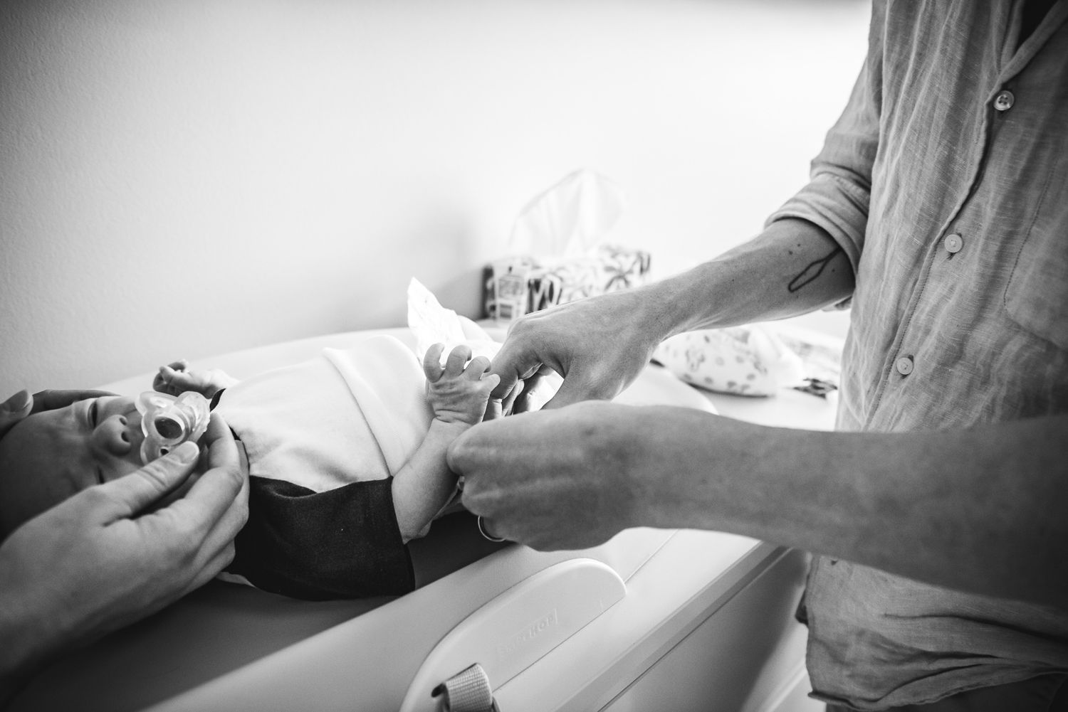 A baby gets a diaper change.