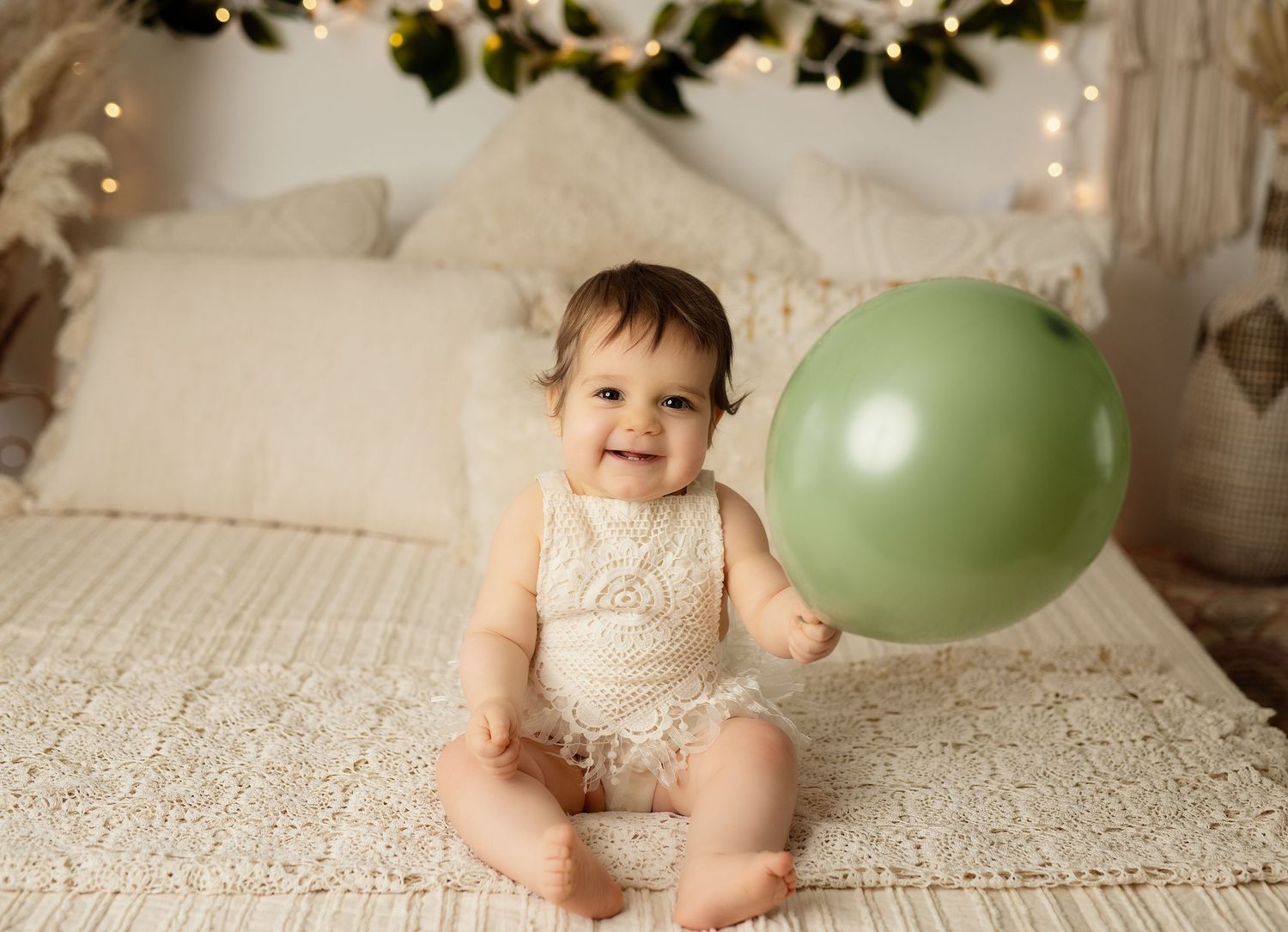 fun and messy cake smash with balloons and cake that we provide one year portraits included