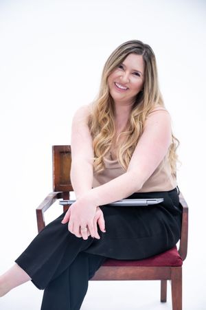 Professional lifestyle portrait series of someone sitting and posing casually on a wooden chair against white background.