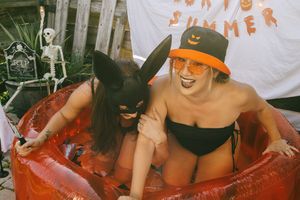 summerween photoshoot in pool for halloween in July