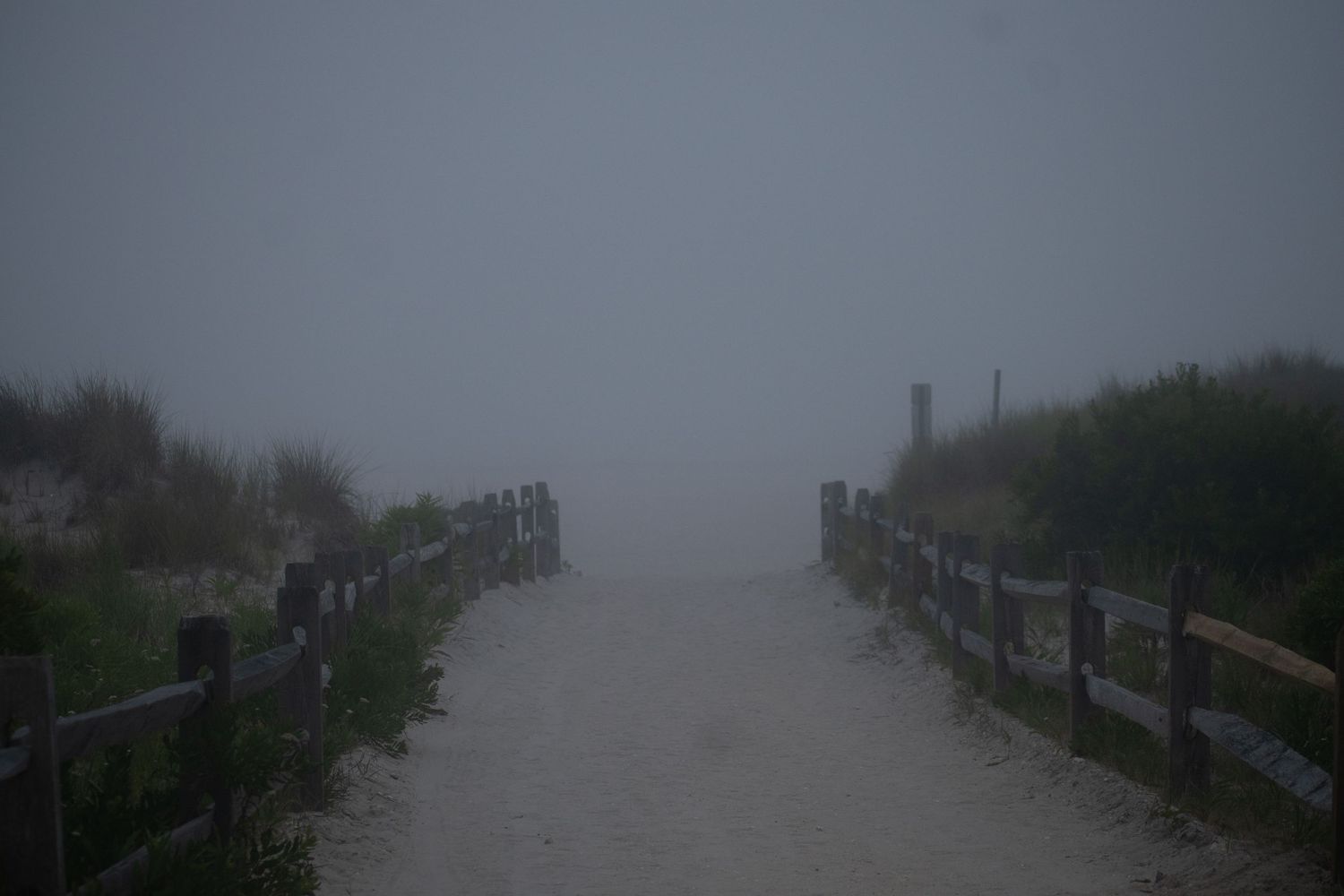 A photo of a foggy walk to the beach