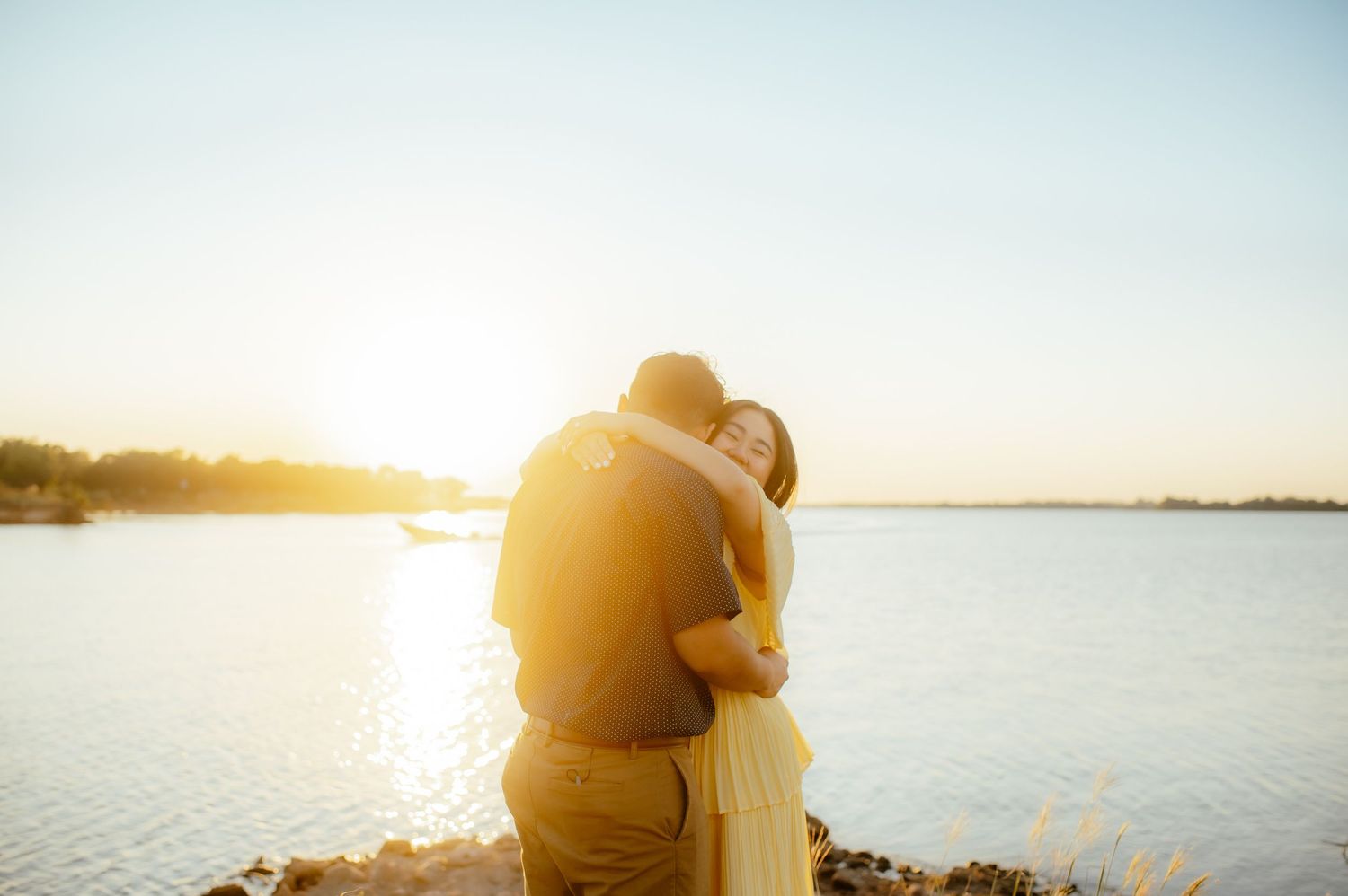 Couple hugging for a photo with an Alva OK Photographer.