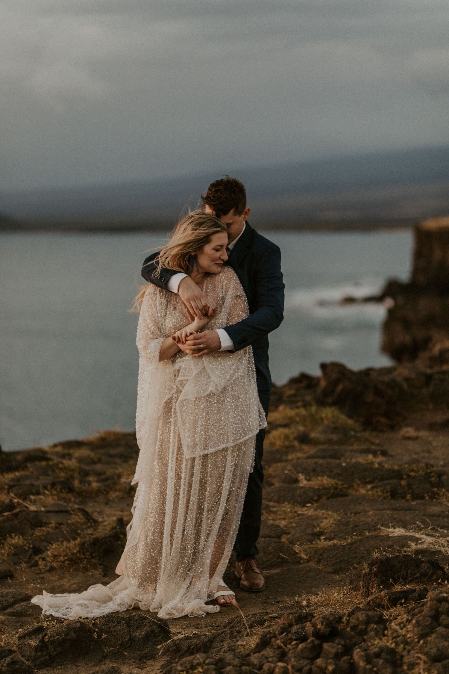 couple in wedding attire eloping in Hawaii in a sparkly wedding dress