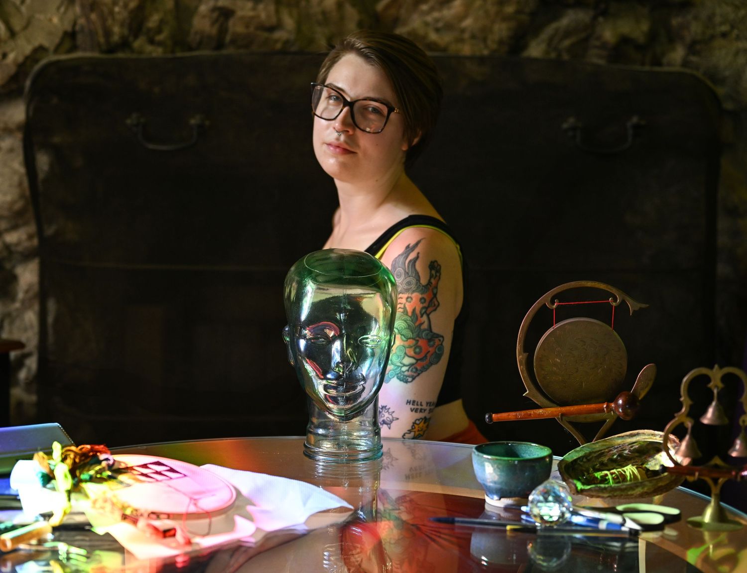 a self portrait of the photographer in her living room, facing the camera