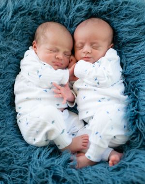 twin baby boys newborn session cuddles connection love sweet natural light studio pose