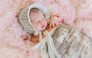 newborn baby girl pose natural light photography studio session handmade bonnet and custom creative set memory captured