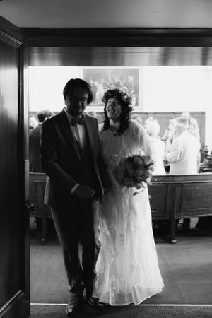 Black and white vintage-style wedding portrait in an elegant indoor setting. Essex Wedding Photographer