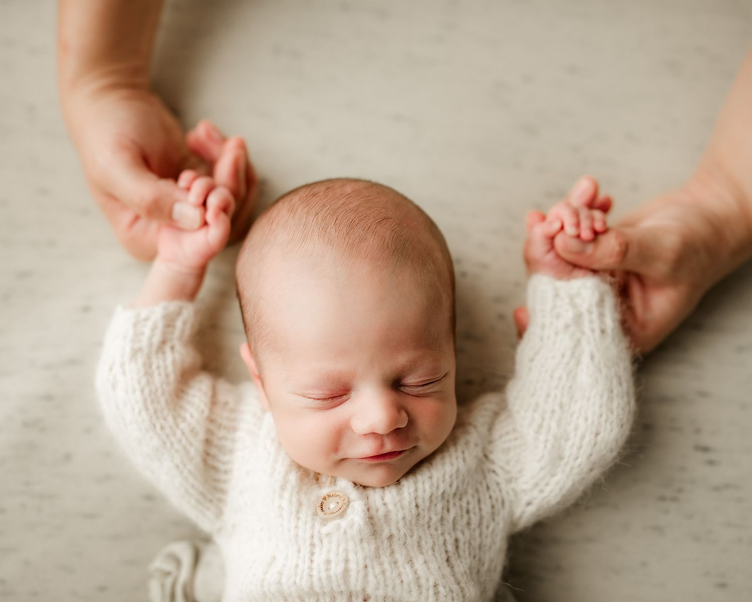 Newborn baby portrait with mom holding baby's fingers | Neutral newborn photographer