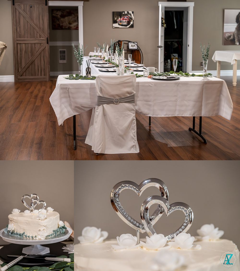 Elegant wedding reception table setting with white linens and wedding cake display.