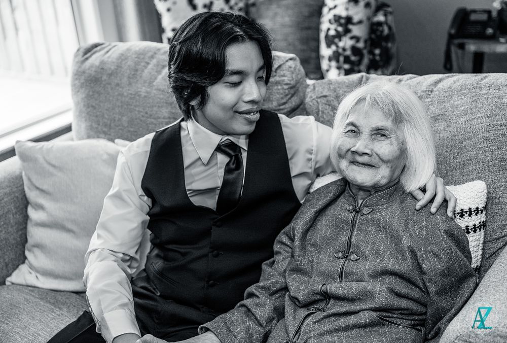 A touching moment shared on a comfortable couch in a living room setting.