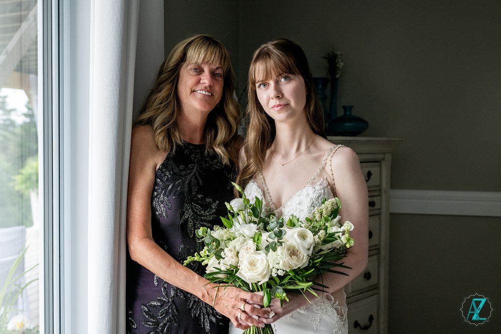 An elegant wedding celebration featuring a beautiful bouquet of white flowers and delicate lace details.