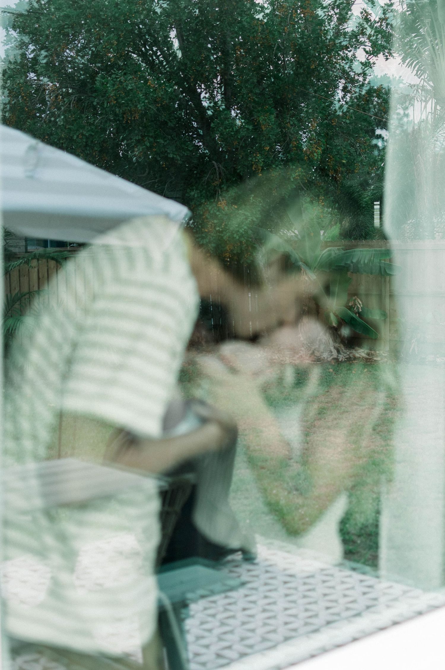 Dreamy window reflection photo with soft natural lighting.