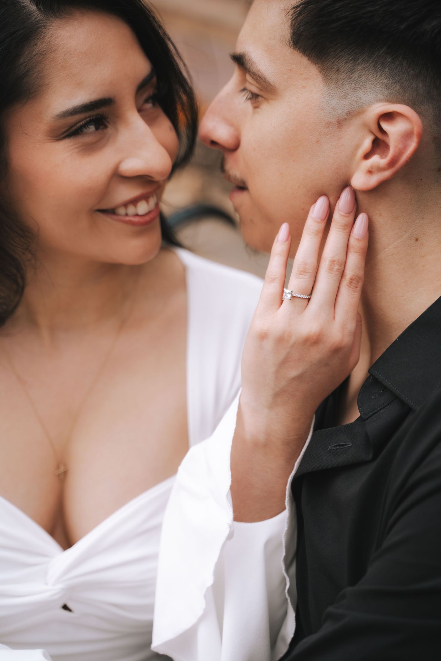 Intimate close-up couple photos showing romantic moments and engagement ring details.
