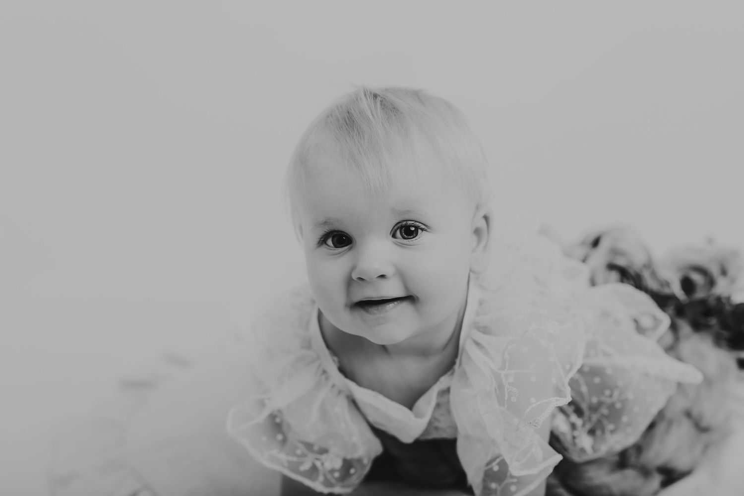 Close-up black and white portrait of a baby with gentle expression. Photographer. Hull. East Yorkshire. Photography