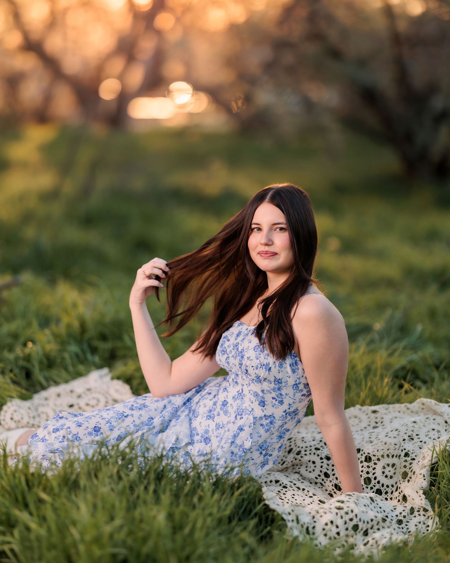 High school senior girl in the desert on grass and golden light Tucson, photographed by Tucson Senior Photographer