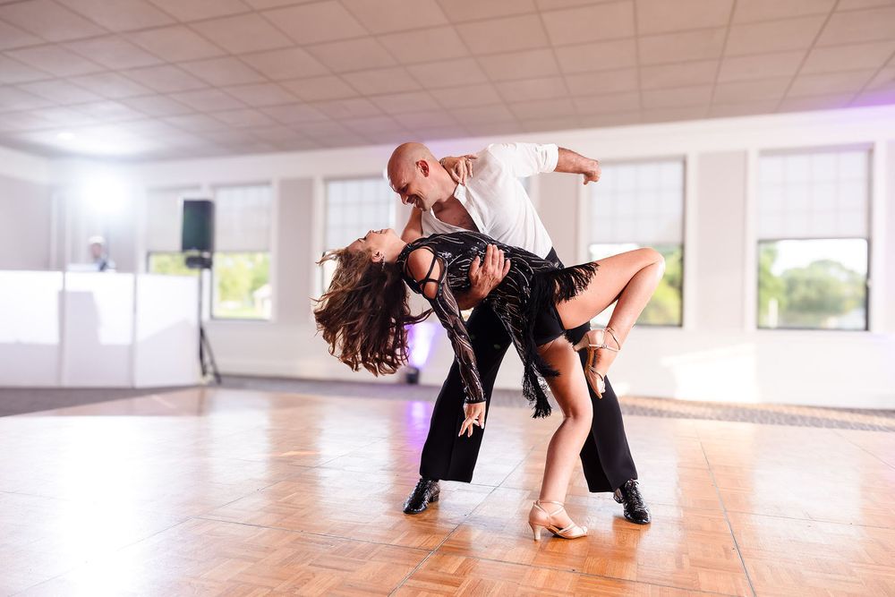 The groom ends the very dramatic first dance with an amazing dip of his new bride